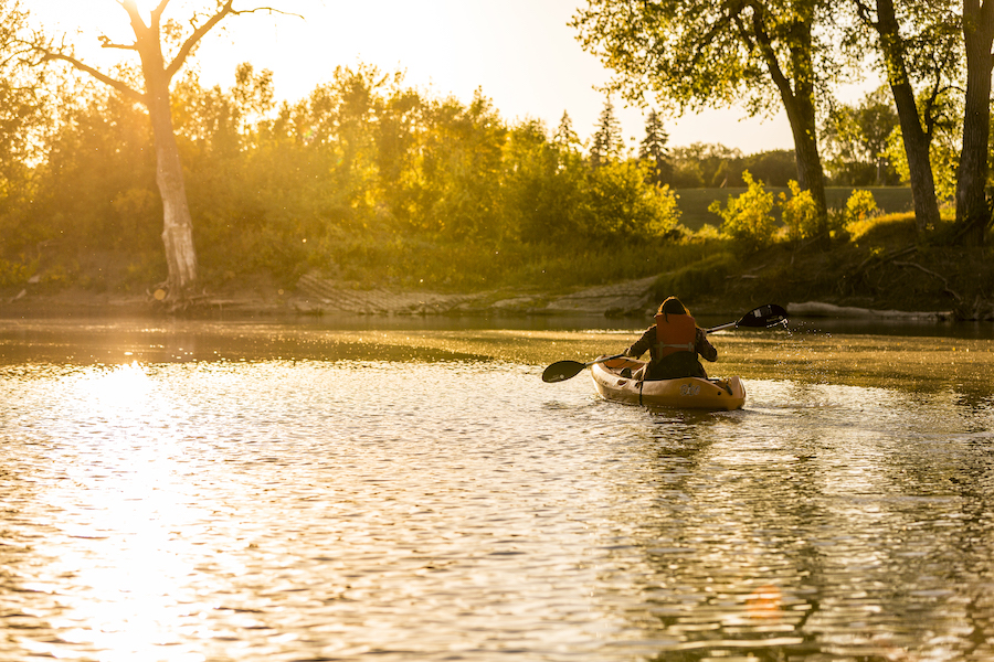 Kayaker on the Red River along the Greenway of Greater Grand Forks | Photo courtesy Visit Grand Forks