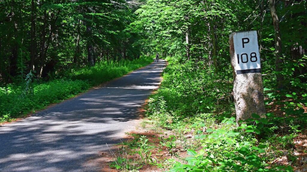 Old railroad mileage marker along the Nashua River Rail Trail | Photo by TrailLink user sc302