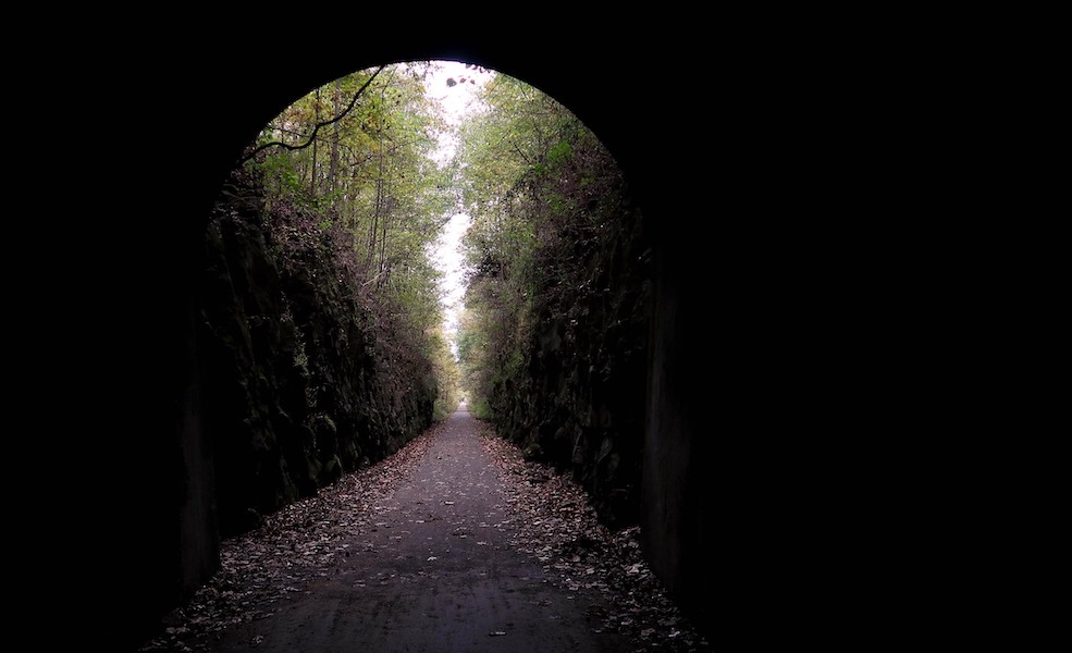 Peering out of the tunnel on Tunnel Hill State Trail | Photo by Shawn Gossman