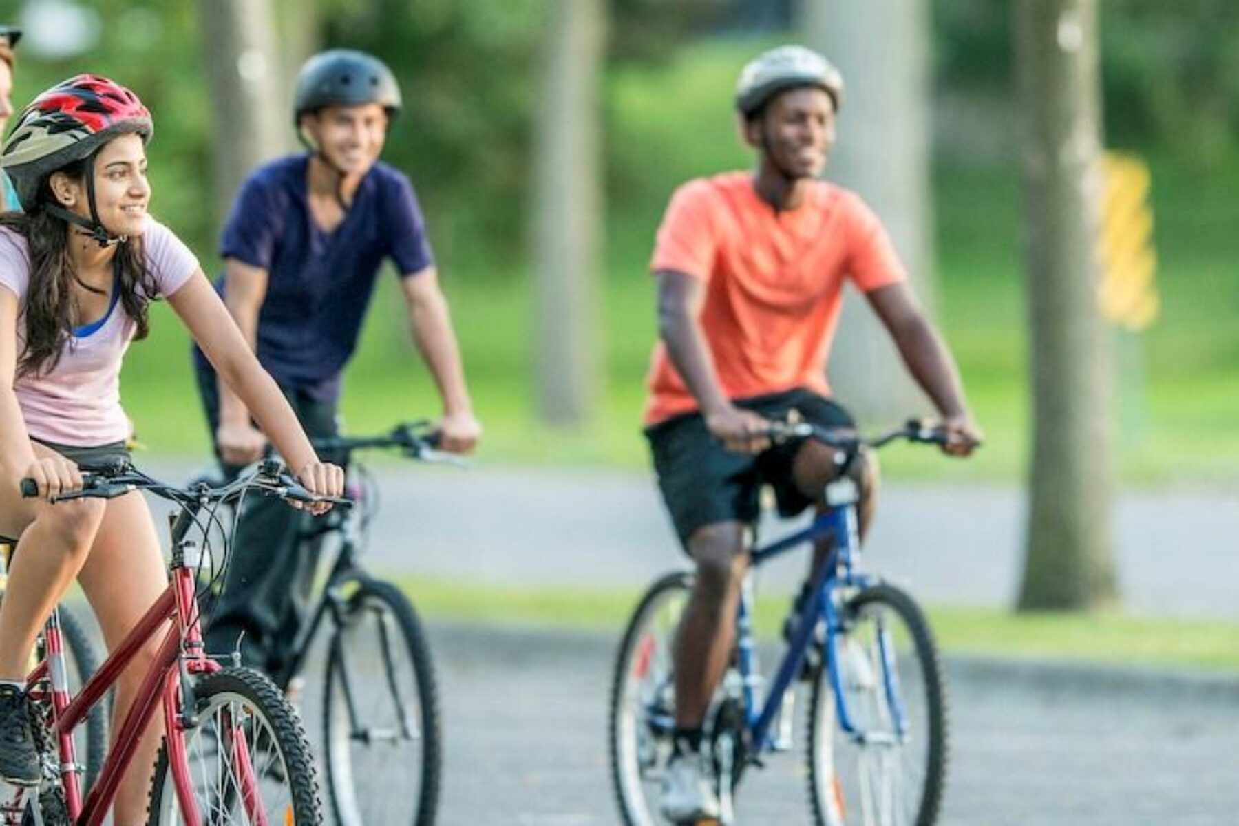 Young adults out riding bikes - Photo courtesy Getty Images