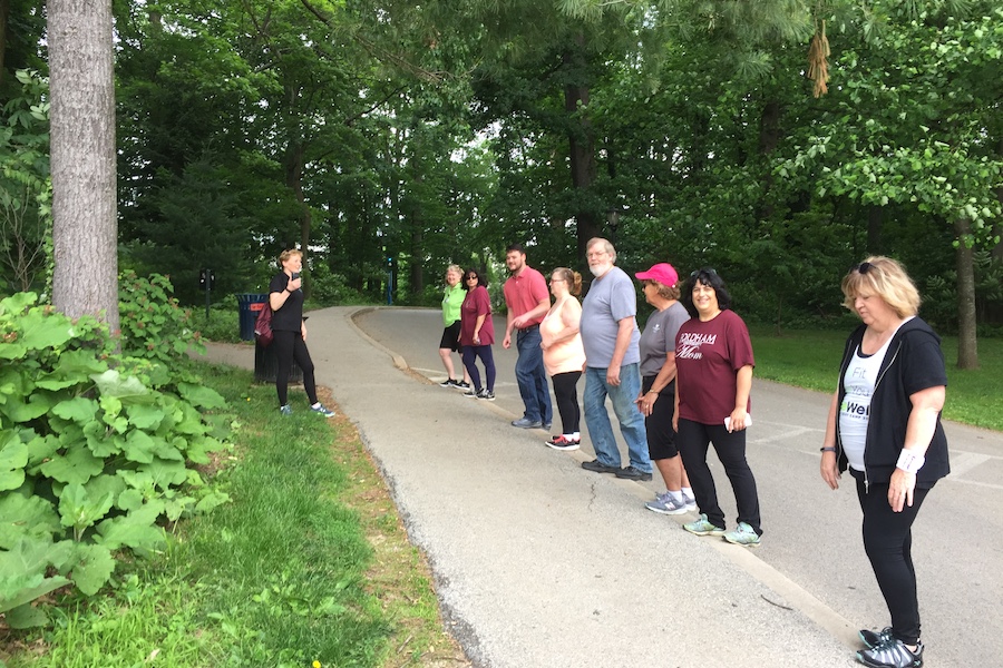 Prescribe-a-Trail participants enjoy a post-trail-walk calf stretch with a Main Line Health podiatrist. | Photo by Molly F. Duffy