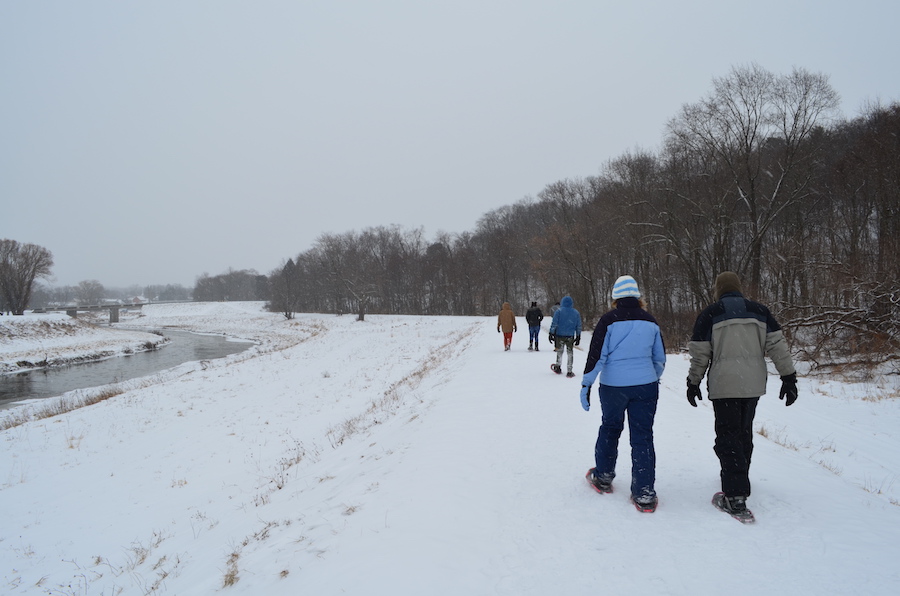 Snowshoers explore the Mahoning Shadow Trail along Punxsutawney’s flood-control dike. | Photo by Danielle Taylor