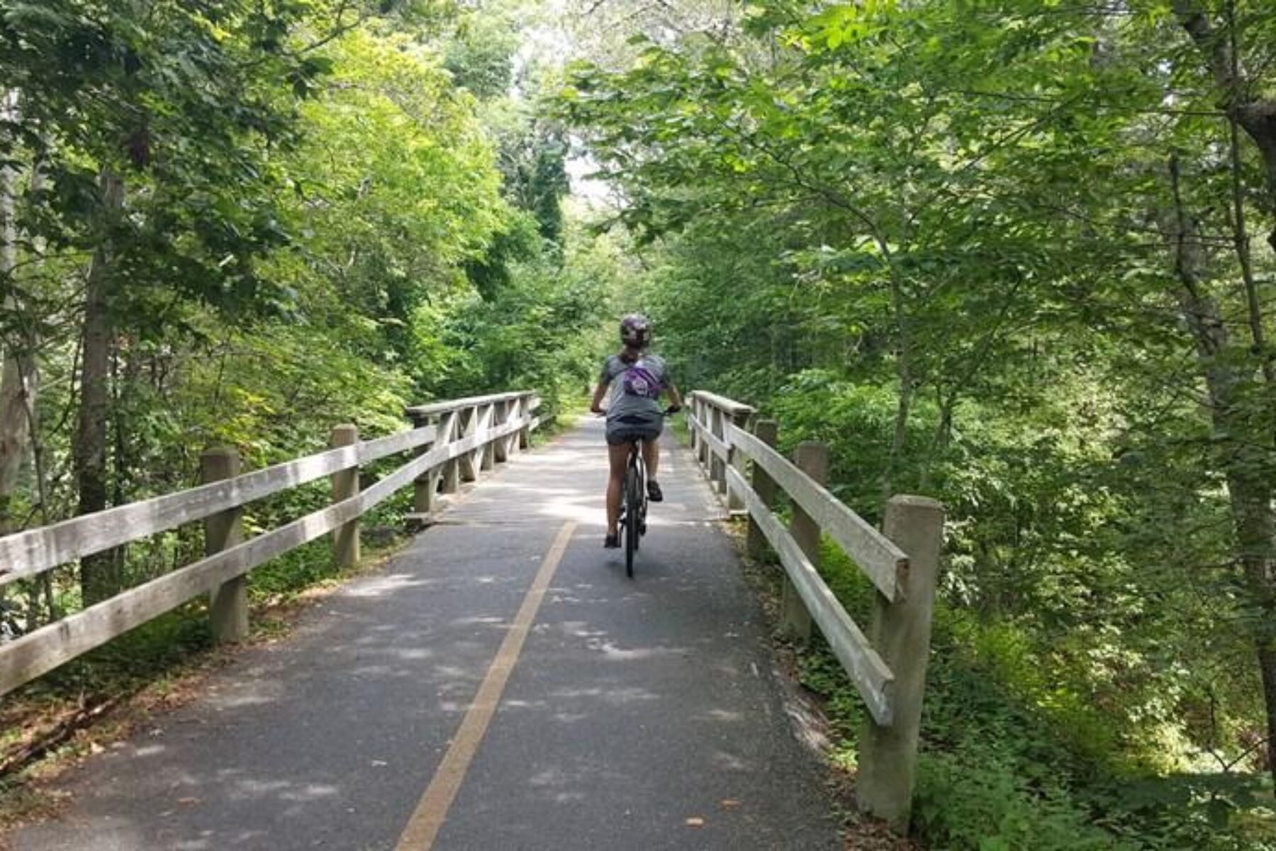 The 10.7-mile Shining Sea Bikeway provides a tranquil experience in Cape Cod, one of New England's popular summer destinations. | Photo by Leeann Sinpatanasakul, courtesy Rails-to-Trails Conservancy