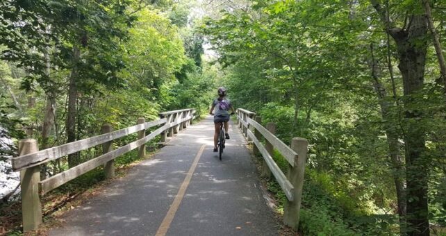 The 10.7-mile Shining Sea Bikeway provides a tranquil experience in Cape Cod, one of New England's popular summer destinations. | Photo by Leeann Sinpatanasakul, courtesy Rails-to-Trails Conservancy