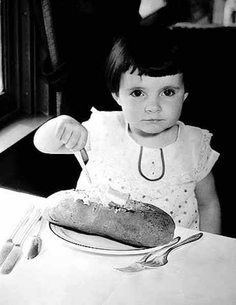 The Northern Pacific’s Great Big Baked Potatoes lived up to their grand name, nearly eclipsing the plate on which they were served (photo circa 1930). | Courtesy Minnesota Historical Society