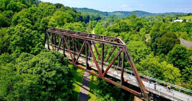 The Panhandle Trail passes beneath a trestle on the Montour Trail | Photo by Milo Bateman