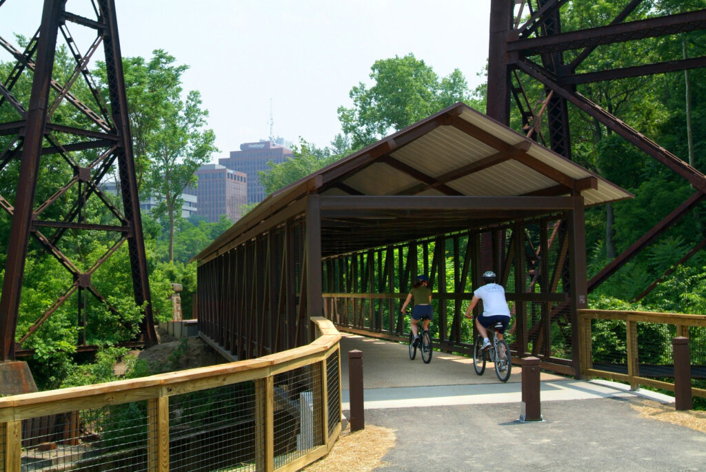 The Towpath Trail bridge near the Mustill Store under Cuyahoga Valley Scenic Railroad trusses | Photo by Bruce Ford, courtesy Summit Metro Parks