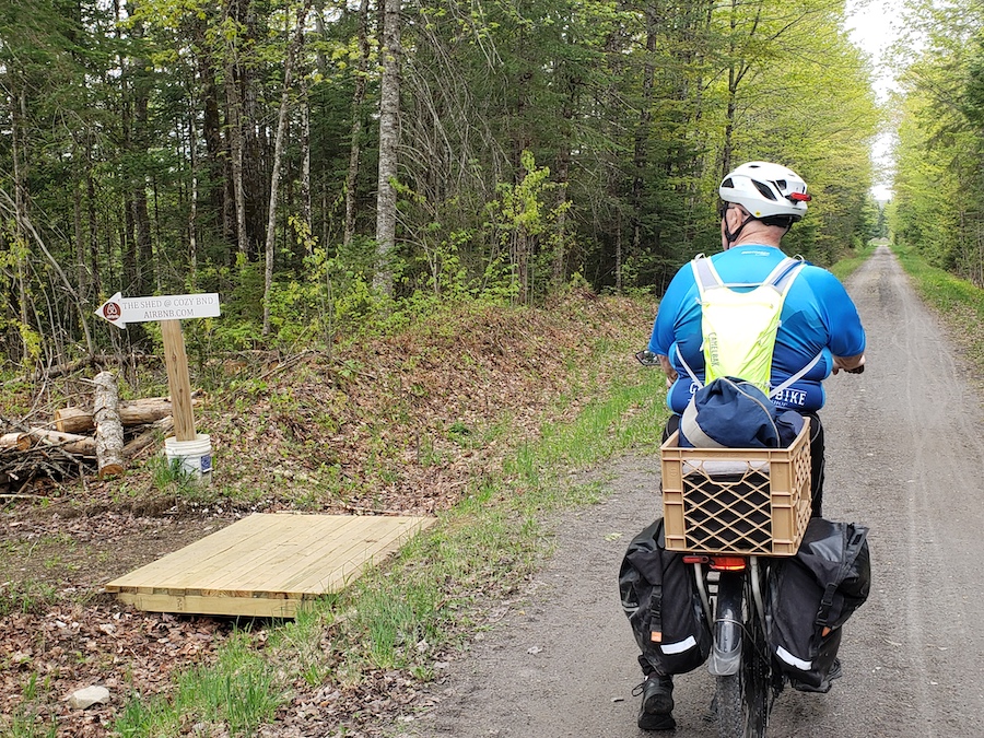 Trailside business signage along Lamoille Valley Rail Trail | Photo by Drew Pollak-Bruce