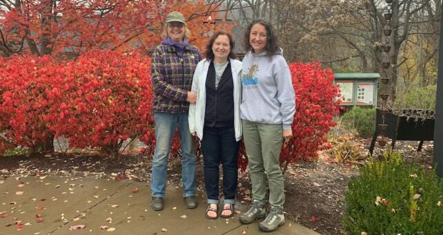 As part of the conference program, longtime West Virginia trail advocates Peggy Pings, Ella Belling and Amanda Pitzer celebrate Ella’s recognition as a leader of trail advocacy on the Mon River Rail-Trail System in Morgantown. | Photo courtesy Amanda Pitzer