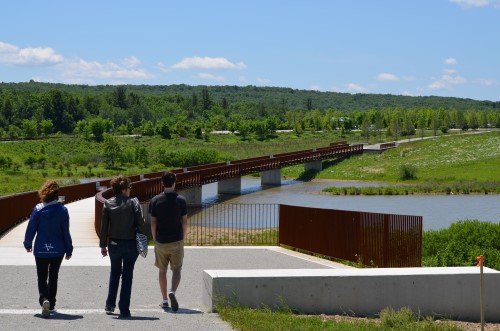 Debby Borza (left) leads visitors along a footpath near the Flight 93 memorial, where 40 people lost their lives during the September 11, 2001, attacks. Borza’s 20-year old daughter Deora Bodley was one of the passengers. | Photo by Charlie Rossi
