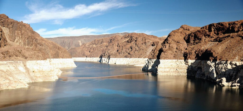 View of the Hoover Dam along the Historic Railroad Trail (section of trail where you can view the dam is closed as of July 2020 due to COVID-19 pandemic) | Photo by Rukmal Kirtisinghe via Flickr | CC BY 2.0
