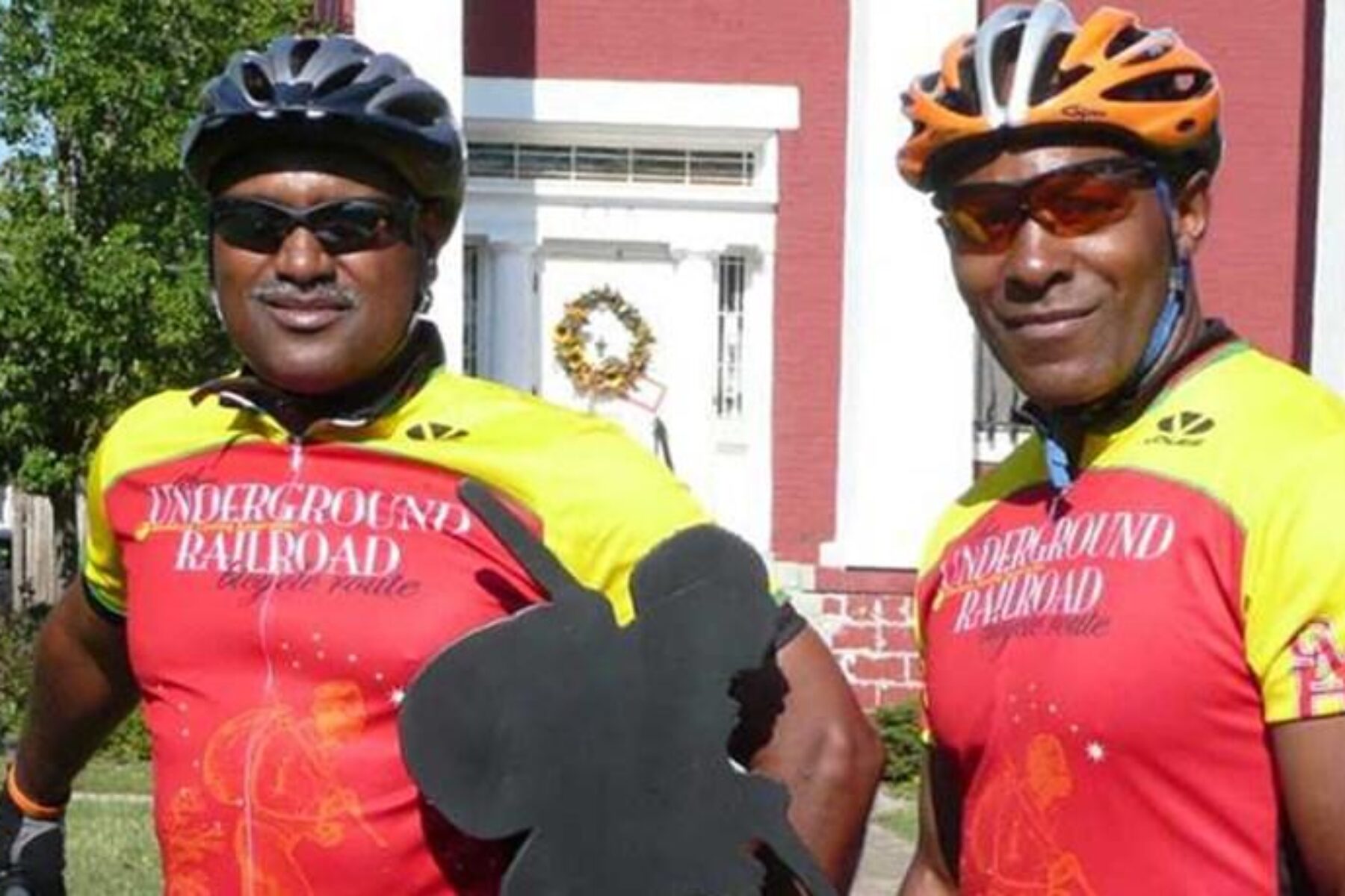 Mario Brown from the Center for Health Equity at the University of Pittsburgh and Adventure Cycling member George Thomas in front of Bertie Hall, along the Niagara River Recreation Trail in Ontario, Canada, during the 2007 inaugural tour of the Underground Railroad Bicycling Route | Photo by C. Spratling, courtesy Adventure Cycling Association