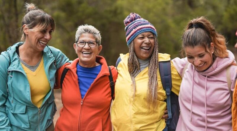 Happy multiracial women having fun embracing each outside - Photo courtesy Getty Images