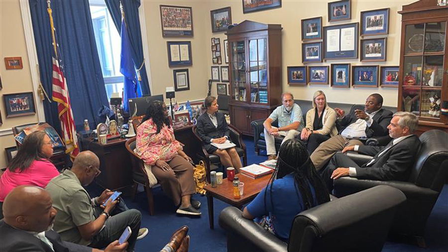 group of people sitting in a political office at the Trailnation city swap 2023