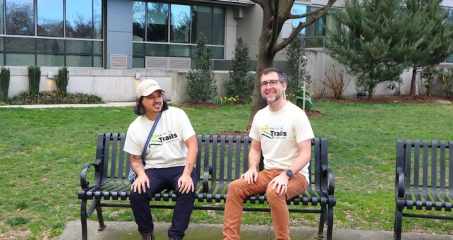 Anthony Le (left) and Kevin Belle (right) in RTC shirts on park bench - Photo by Lauren Swan, courtesy RTC