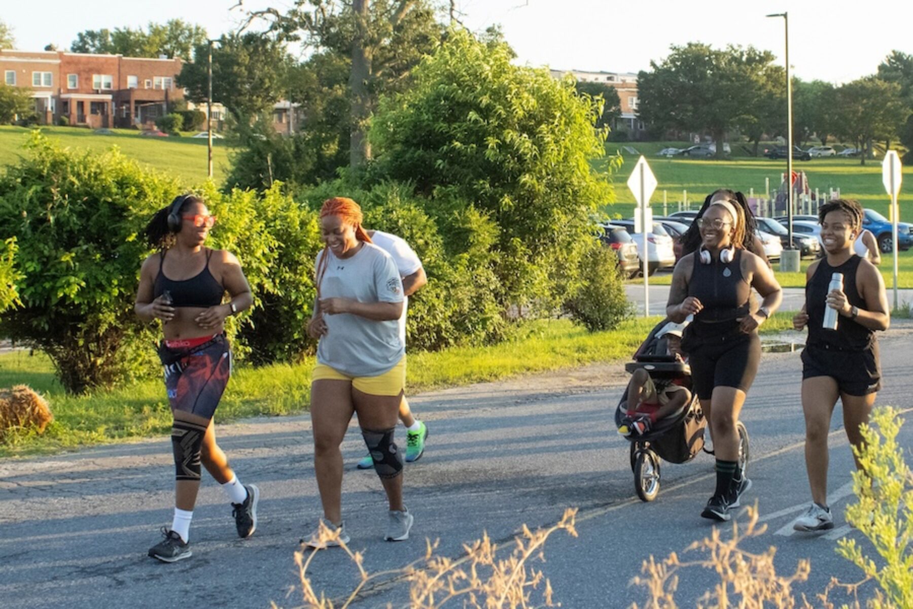 People jogging together on a trail in Baltimore, Maryland | Photo by Allison Abruscato