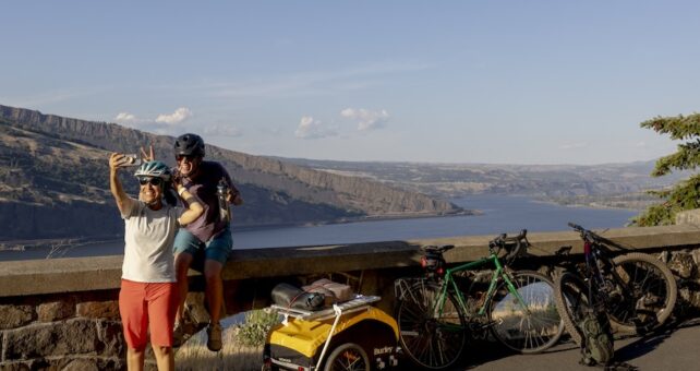 2 people taking selfie with cargo bikes | Photo courtesy of Burley