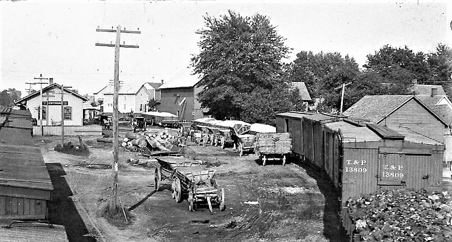 Circa 1915: Train coming in to the Updike mill, which can be seen in the background. The CA&C Depot is to the left, and the Bishop Coal and Lumber Company is to the right. | Courtesy Knox County Historical Society