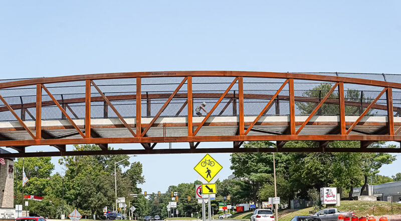Opened in the summer of 2024, this 147-foot-long pedestrian bridge on the W&OD Trail provides safe crossings for people over busy Wiehle Avenue in Reston, Virginia. | Photo by Albert Ting