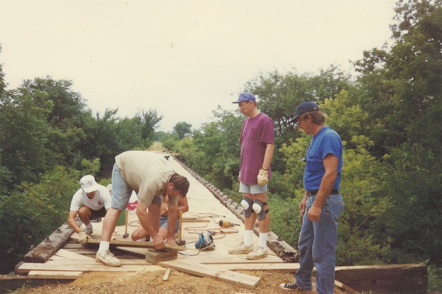 Volunteers working on the Tarkio River bridge on the Wabash Trace Nature Trail in the 1990s | Photo courtesy Bill Hillman
