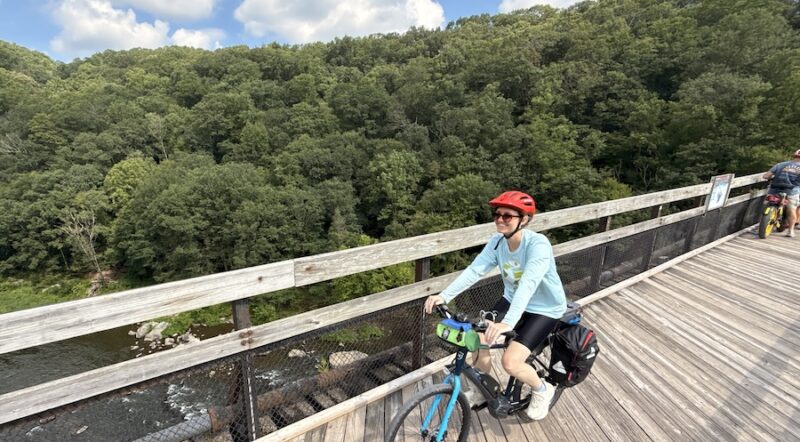 Bicyclist on trestle bridge along the Great Allegheny Passage (GAP, gaptrail.org) | Photo by Ashley Stimpson