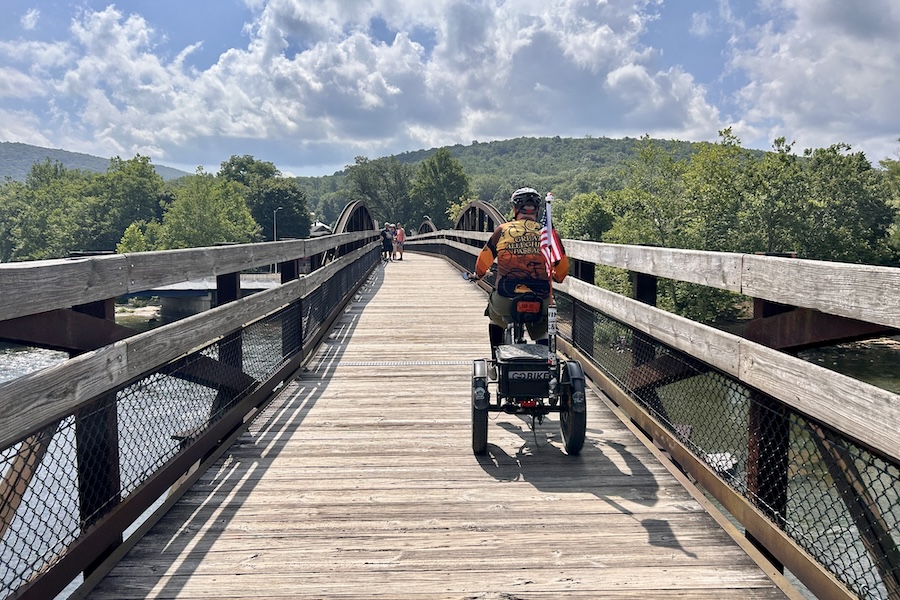 Bicyclist and walkers on a bridge along the Great Allegheny Passage (GAP, gaptrail.org) | Photo by Ashlee Stimpson