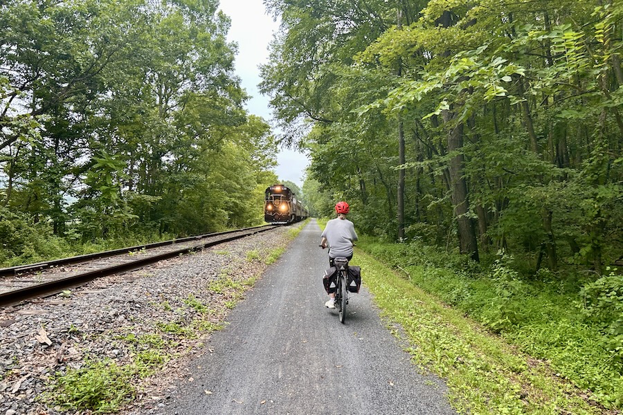 Bicyclist on rail-with-trail section of the Great Allegheny Passage (GAP, gaptrail.org) | Photo by Ashlee Stimpson
