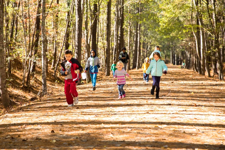 Children and family walking along North Carolina's American Tobacco Trail | Photo courtesy Wake County Government
