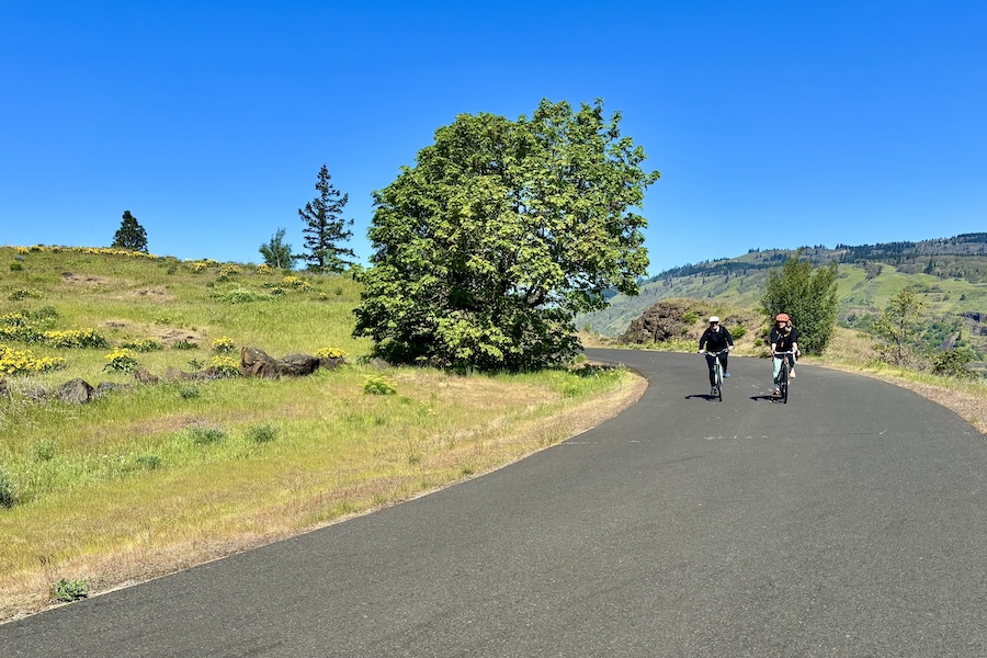 Two bicyclists along the Mosier Segment of Oregon’s Historic Columbia River Highway State Trail | Photo by Glenn Zinkus
