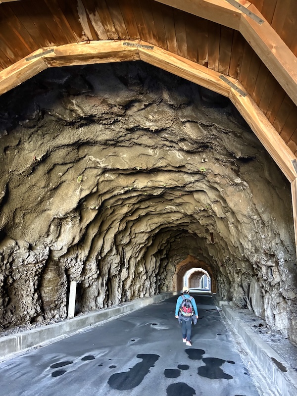Walker in Mosier Twin Tunnels along Oregon’s Historic Columbia River Highway State Trail | Photo by Glenn Zinkus