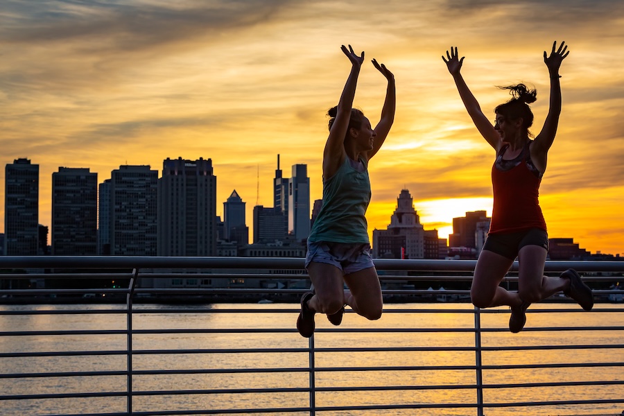 Two people jumping in New Jersey's Wiggins Park, part of the Circuit Trails | Photo by Thom Carroll