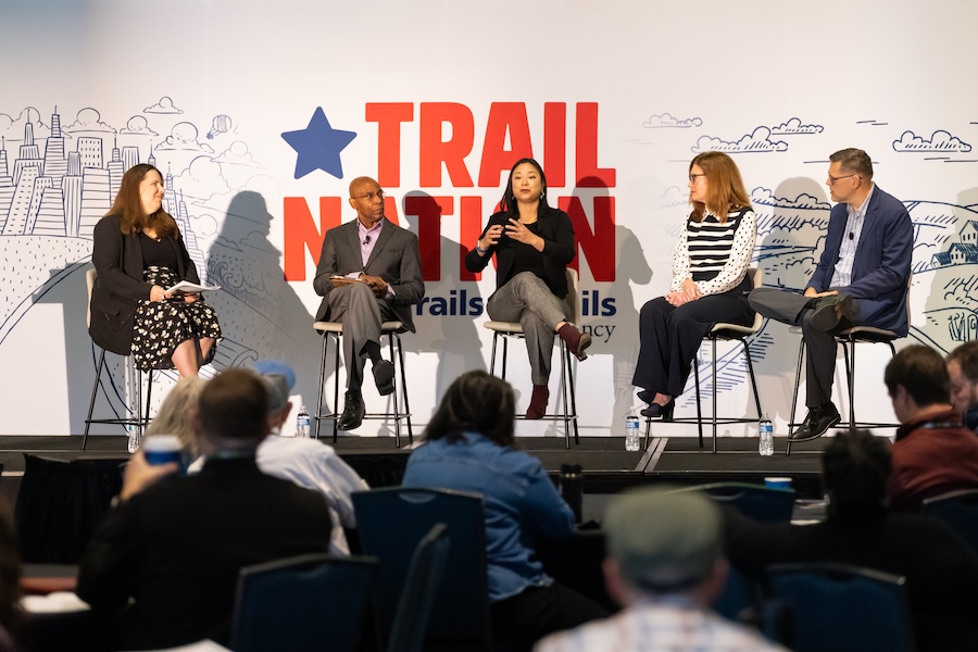 Joyce Pan Huang, Chief Impact Officer, Cleveland Foundation, speaking (center) on "Philanthropy’s Role in Powering Community Growth Through Trails" panel | Photo by Dave Pelosi, Clum Creative
