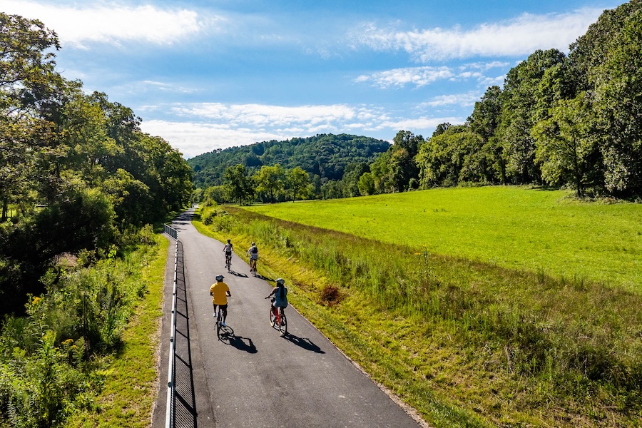Bicyclists ride the Ecusta Trail in Hendersonville, NC | Photo by Derek DiLuzio, courtesy Visit Hendersonville