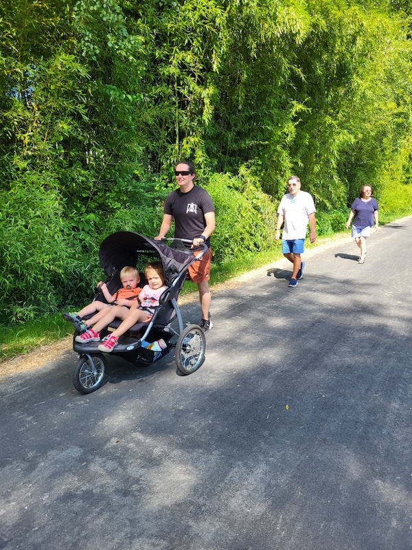 Walkers including with baby carriage along North Carolina's Ecusta Trail | Photo courtesy Friends of the Ecusta Trail