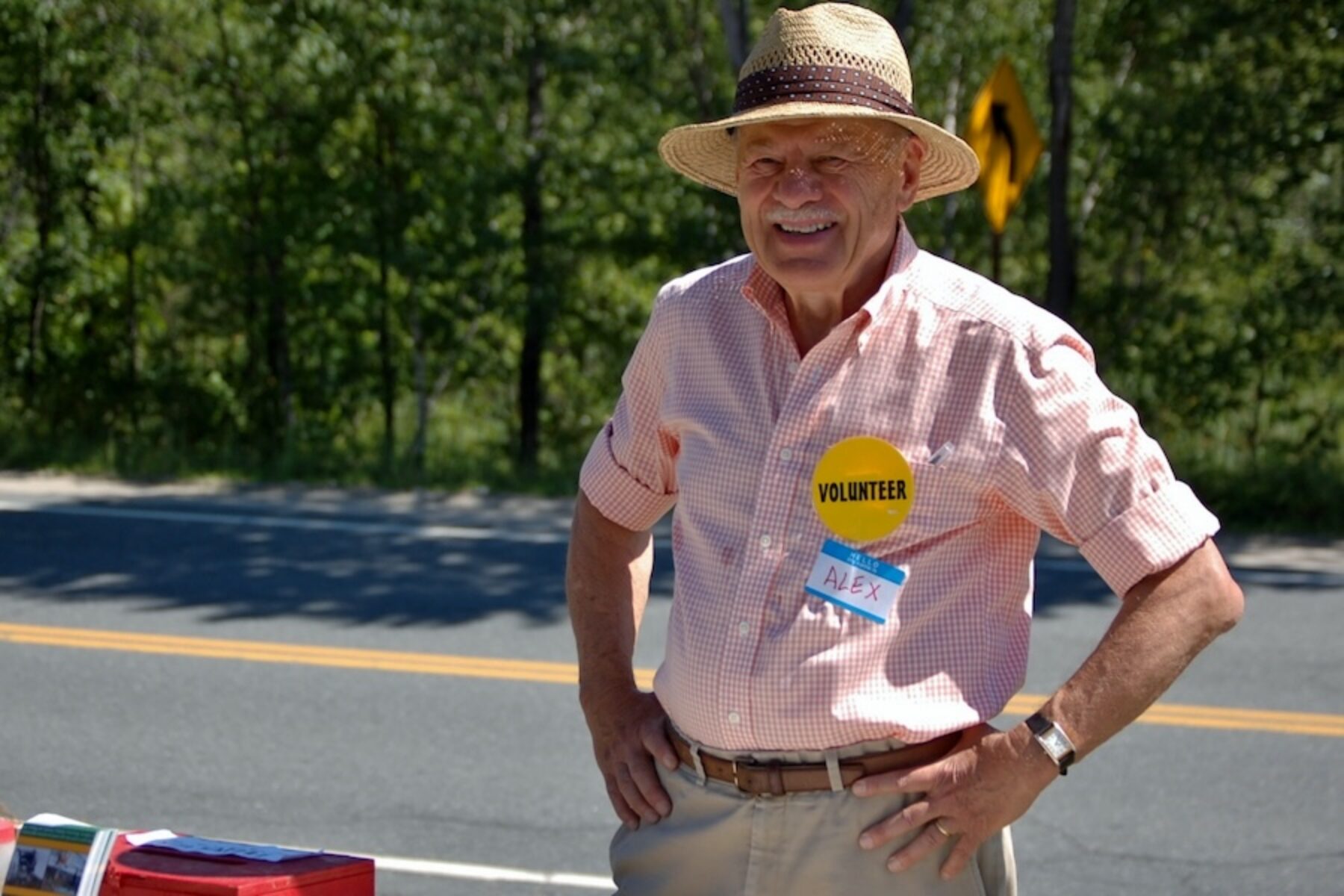 Alex Bernhard manning a Friends of the Northern Rail Trail info table in 2011 | Photo courtesy Lindy Heim, Friends of the Northern Rail Trail