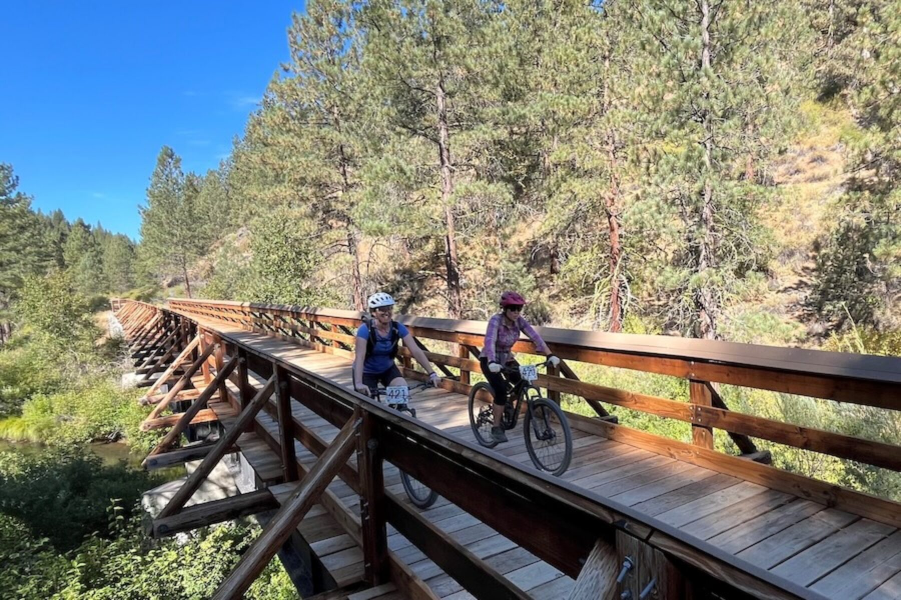 Bicyclists on a bridge along California's Bizz Johnson Trail | Photo by Cindy Barks