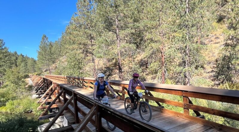 Bicyclists on a bridge along California's Bizz Johnson Trail | Photo by Cindy Barks
