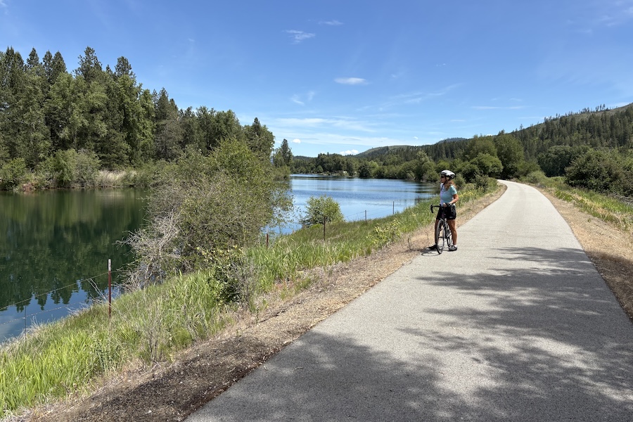 Laura Anderson enjoying the scenic view along Idaho's Trail of the Coeur d'Alenes | Photo courtesy Dave and Laura Anderson