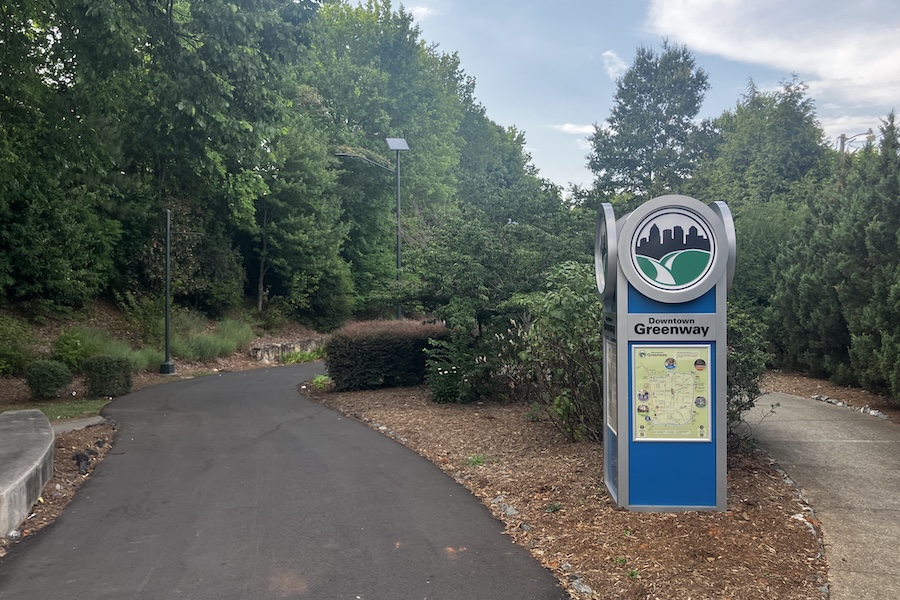 Trailside signage along Greensboro's Downtown Greenway | Photo by Adam Rosen